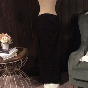 Long black skirt with side slit.